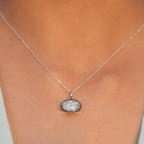 View of ice oval cut moissanite solitaire pendant 