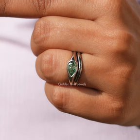 Pear Cut East West Bridal Ring Set In finger