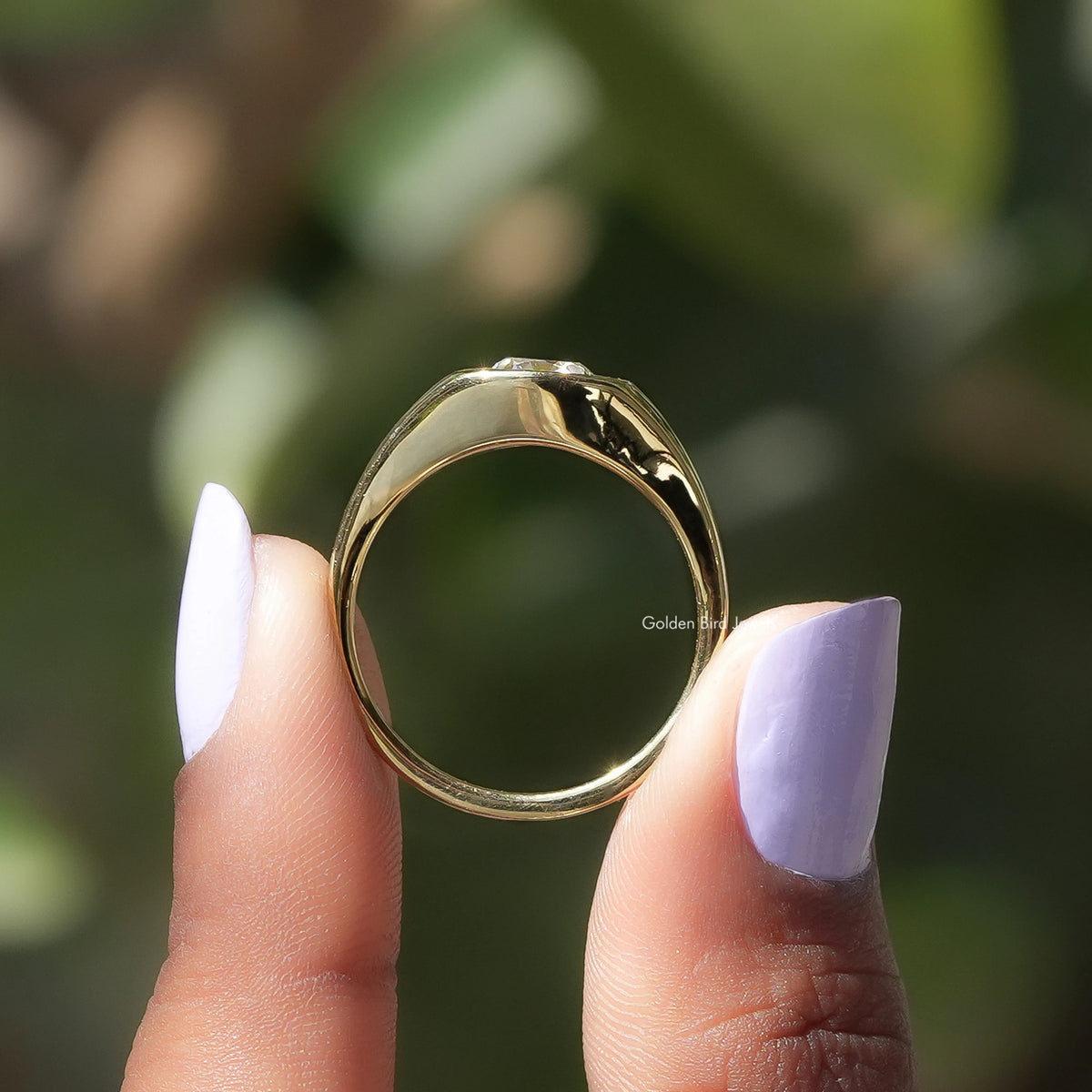 Back View of Old Mine Cushion Cut Moissanite Ring In two fingers