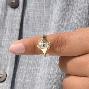 In finger front View of Cushion And Round Cut Moissanite Ring In Yellow Gold