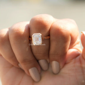 Front View of Moissanite Emerald Cut Engagement Ring In Finger
