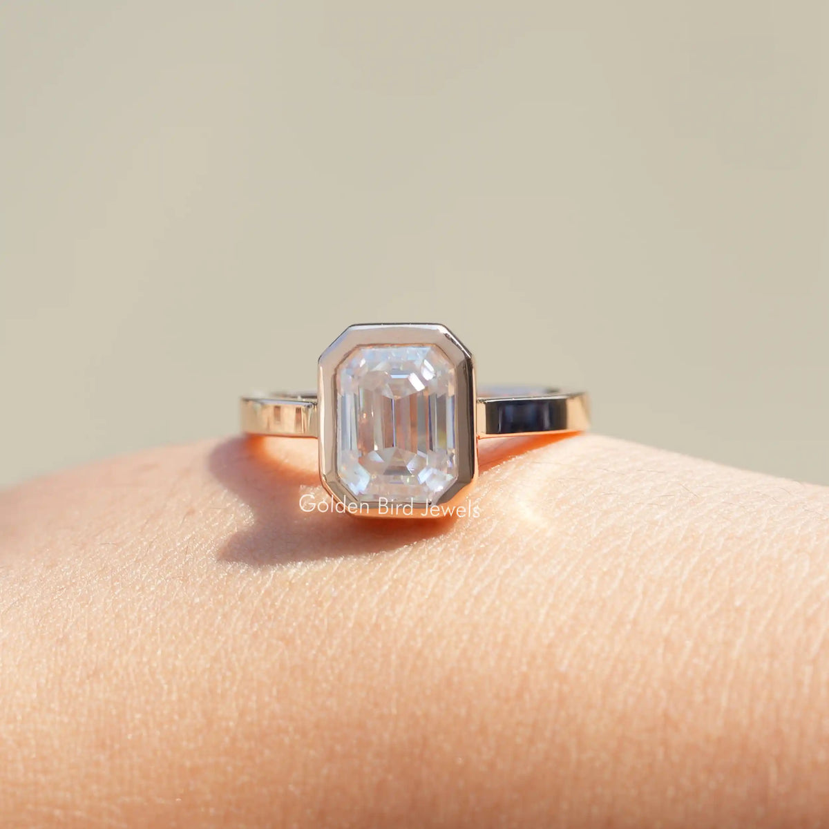Front View of Bezel Set Emerald Cut Moissanite Engagement Ring