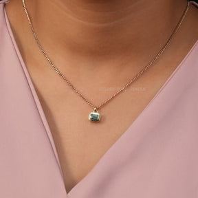 [In neck front view of emerald cut moissanite pendant]-[Golden Bird Jewels]