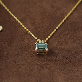 [Front view of moissanite emerald cut pendant in 14k yellow gold]-[Golden Bird Jewels]