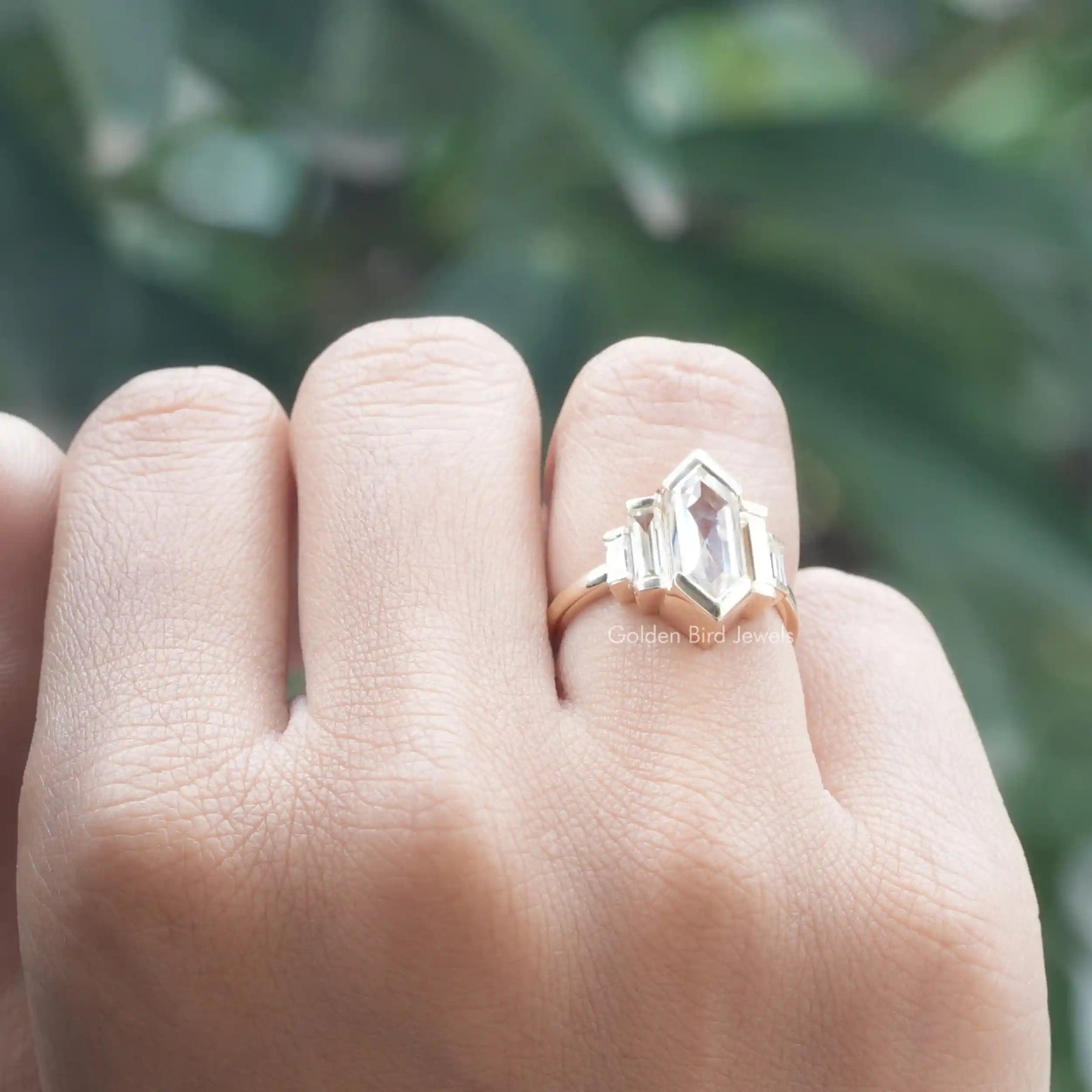 [In finger front view of baguette cut engagement ring made of 14k yellow gold]-[Golden Bird Jewels]