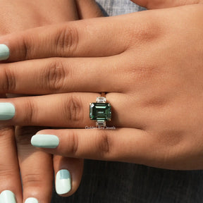 View of Three Stone Emerald Cut Ring In finger