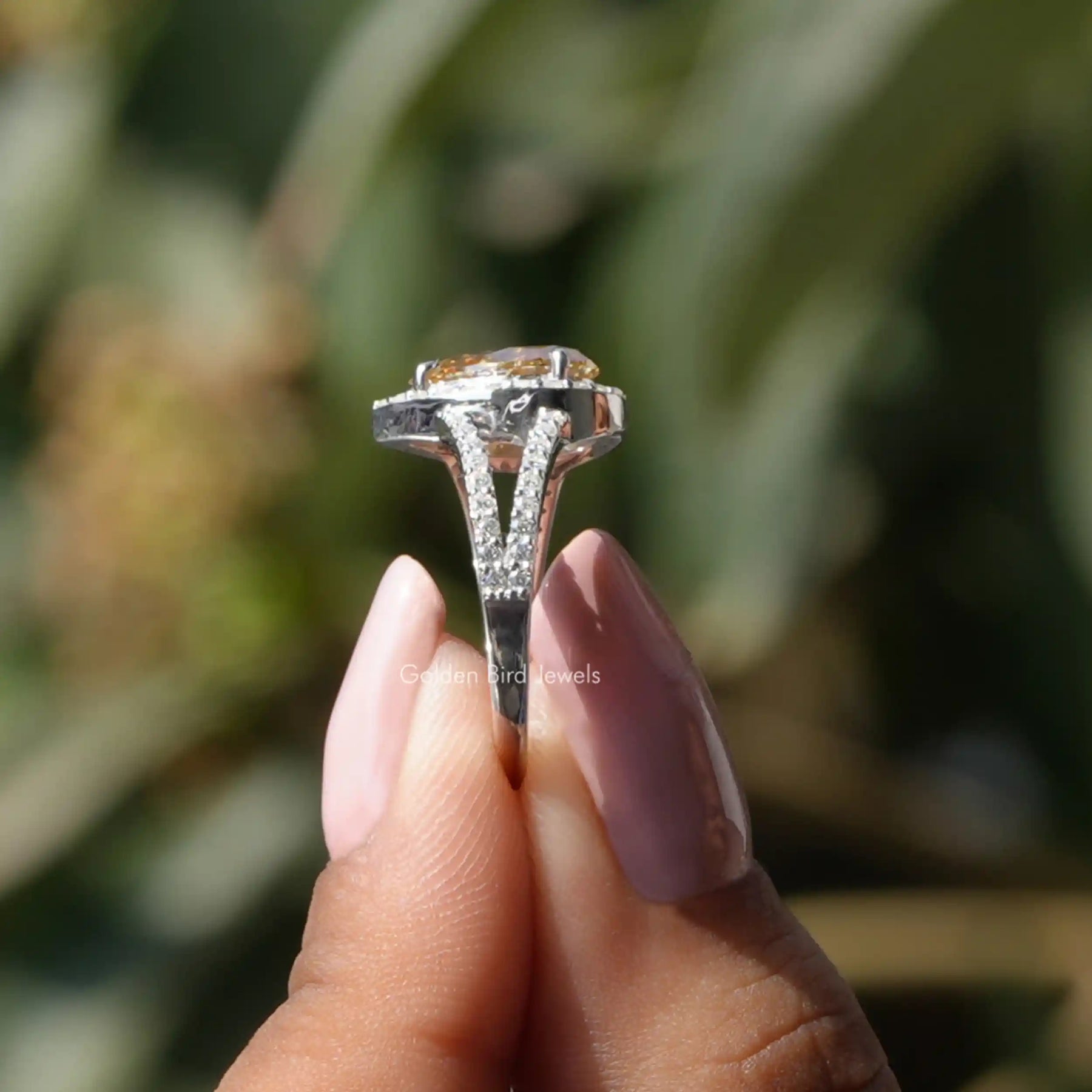 [Side view of pear shaped moissanite engagement ring made of round cut side stones]-[Golden Bird Jewels]