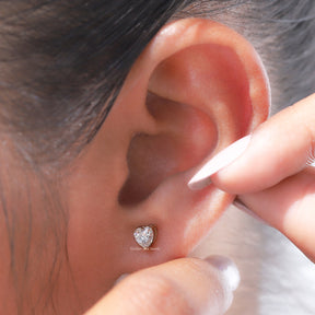 Front view of heart cut moissanite stud earrings in  yellow gold
