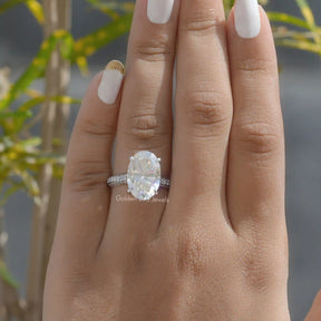 View of Hidden Halo Oval Cut Engagement Ring In Finger