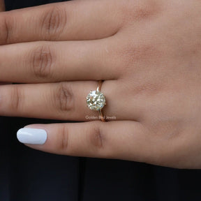 View of Round Solitaire Moissanite Engagement Ring In Yellow Gold