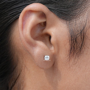 In ear view of cushion cut cluster moissanite earrings

