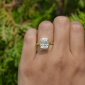 Close-Up View of Moissanite Old Mine Cushion Solitaire Ring In Yellow Gold 