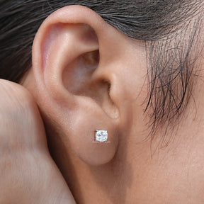 Detailed view of moissanite earrings in secure setting 
