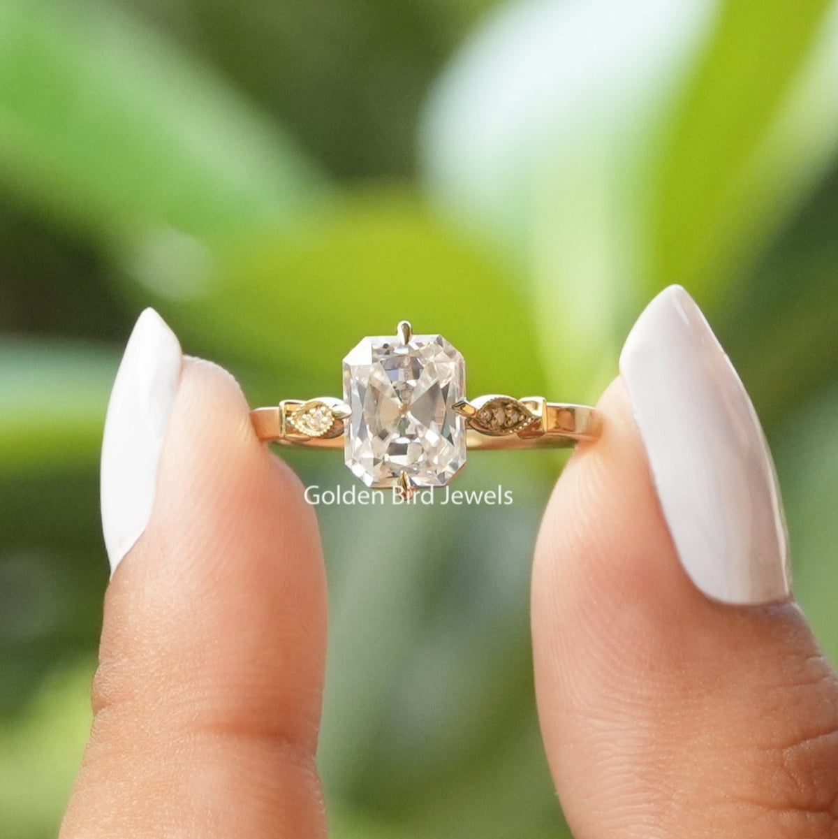 [In two finger front view of moissanite old mine radiant cut engagement ring made of prong setting]-[Golden Bird Jewels]
