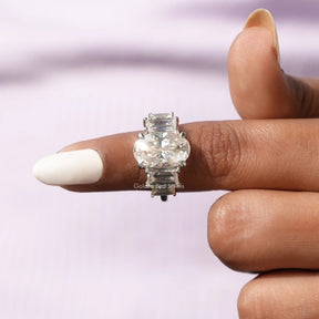 [In figer front view of crushed ice oval cut 5 stone moissanite ring]-[Golden Bird Jewels]