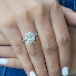 [In hand front view of halo moissanite engagement ring]-[Golden Bird Jewels]