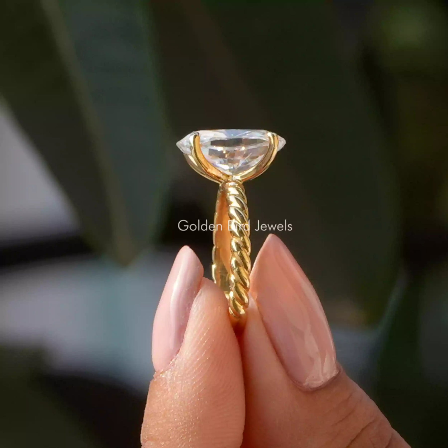 [Side view of oval cut solitaire moissanite ring]-[Golden Bird Jewels]
