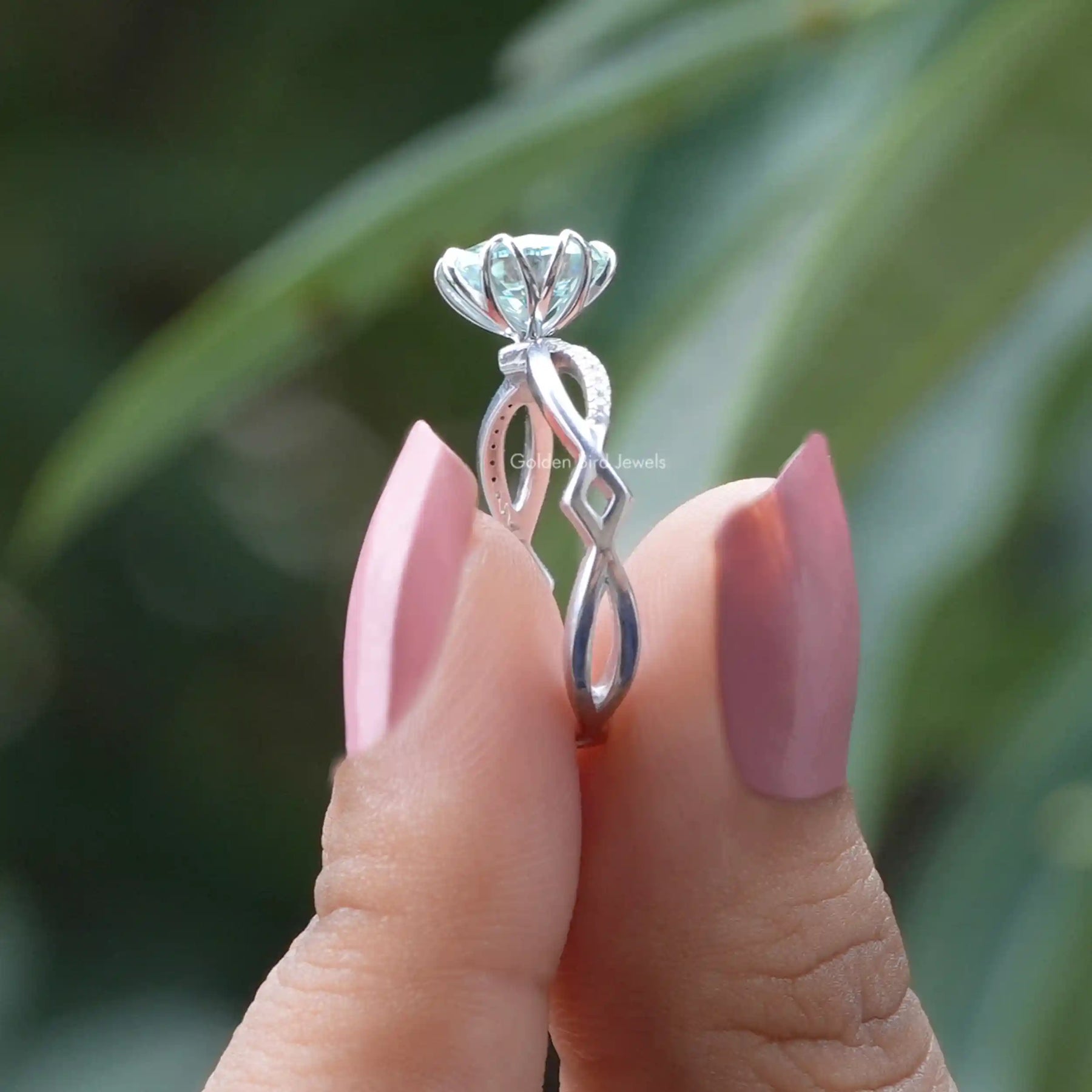 [Side view of oval cut moissanite twisted shank ring in 14k white gold]-[Golden Bird Jewels]