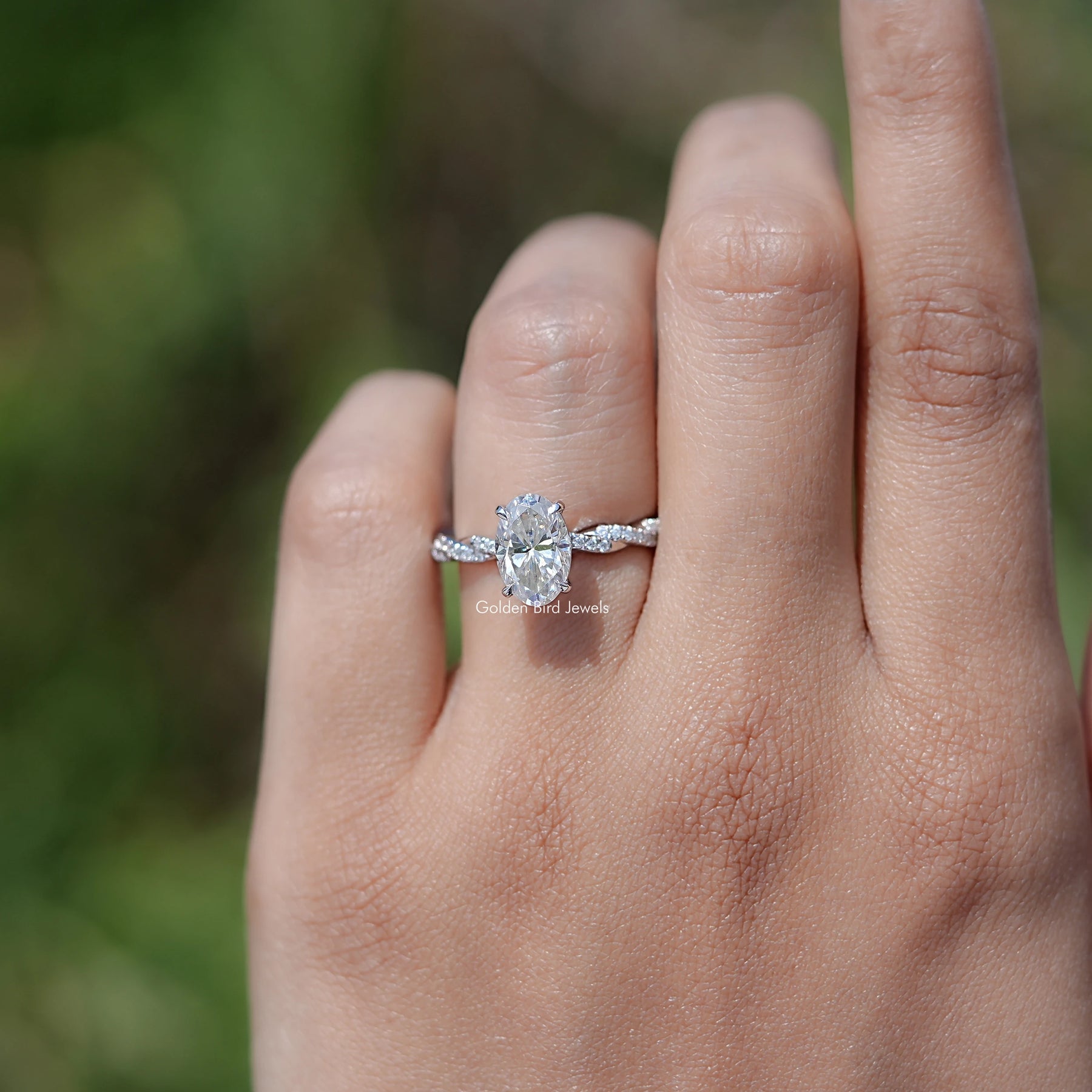 Oval Shaped Moissanite Twisted Shank Accent Ring