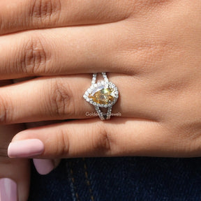 [In finger front view of pear shaped halo moissanite engagement ring]-[Golden Bird Jewels]