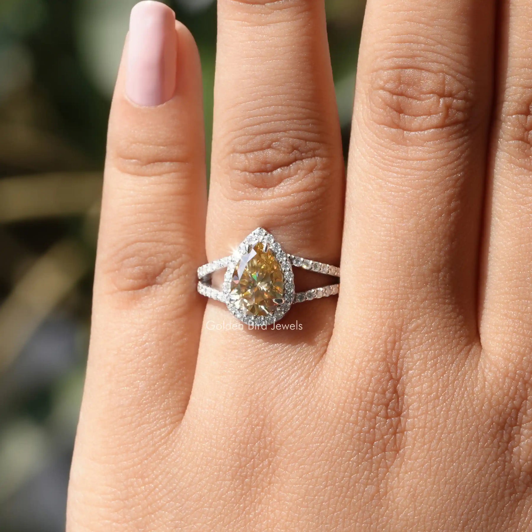[In finger front view of pear shaped moissanite ring]-[Golden Bird Jewels]