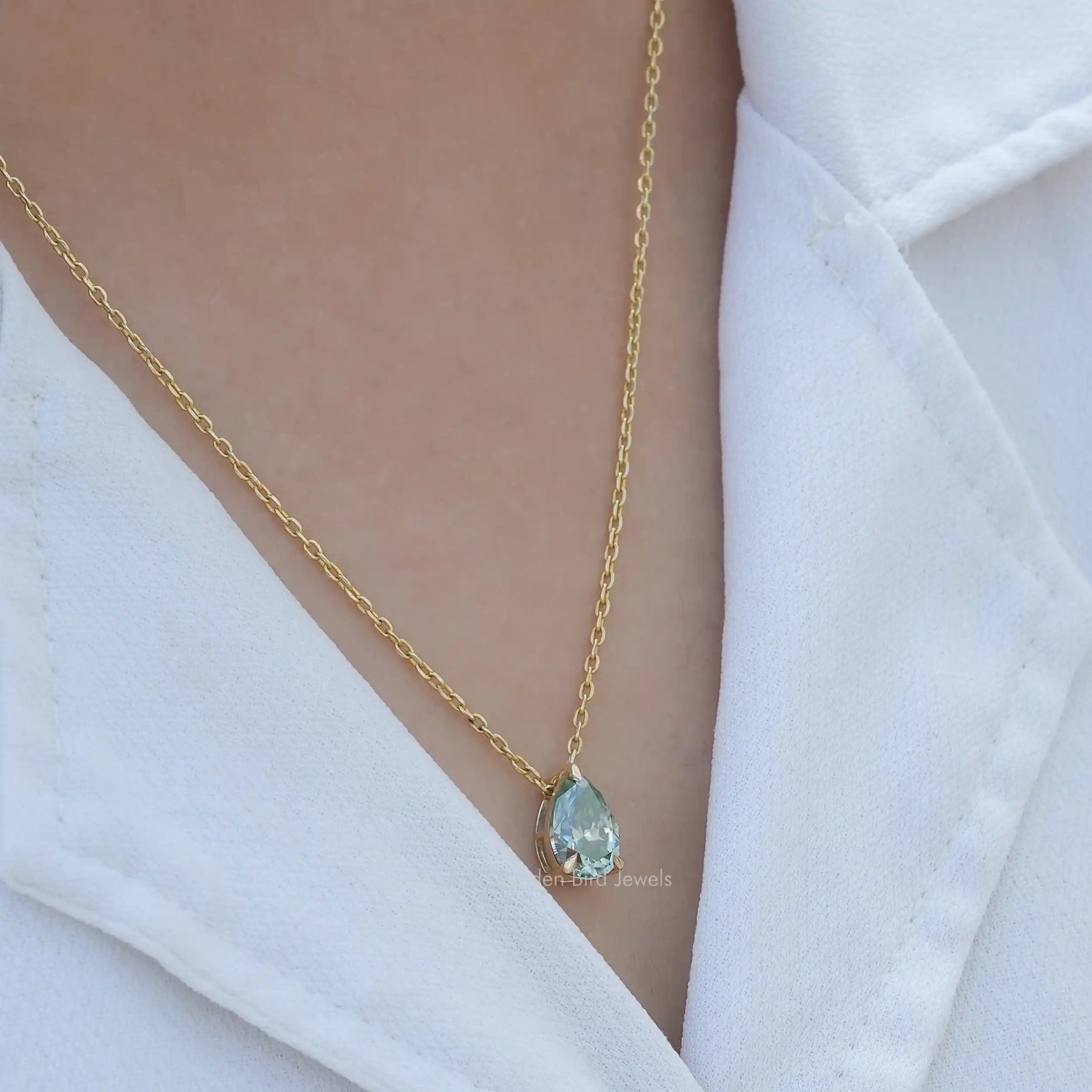 [In neck front view of moissanite solitaire pendant in 14k yellow gold]-[Golden Bird Jewels]