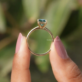 Back View of Radiant Cut Solitaire Engagement Ring In two fingers