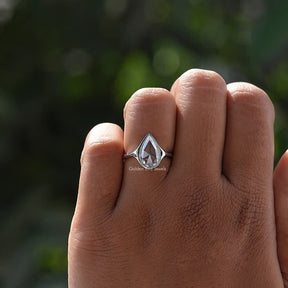 Pear Cut Moissanite Solitaire Ring In finger