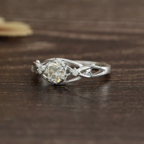 [Side view of round cut moissanite engagement ring set in 14k white gold]-[Golden Bird Jewels]