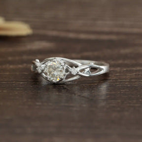 [Side view of round cut moissanite engagement ring set in 14k white gold]-[Golden Bird Jewels]