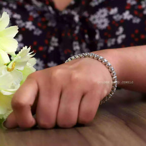 In hand showing view of moissanite bracelet