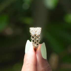 Side View of Round Cut Moissanite Wedding Ring In two fingers