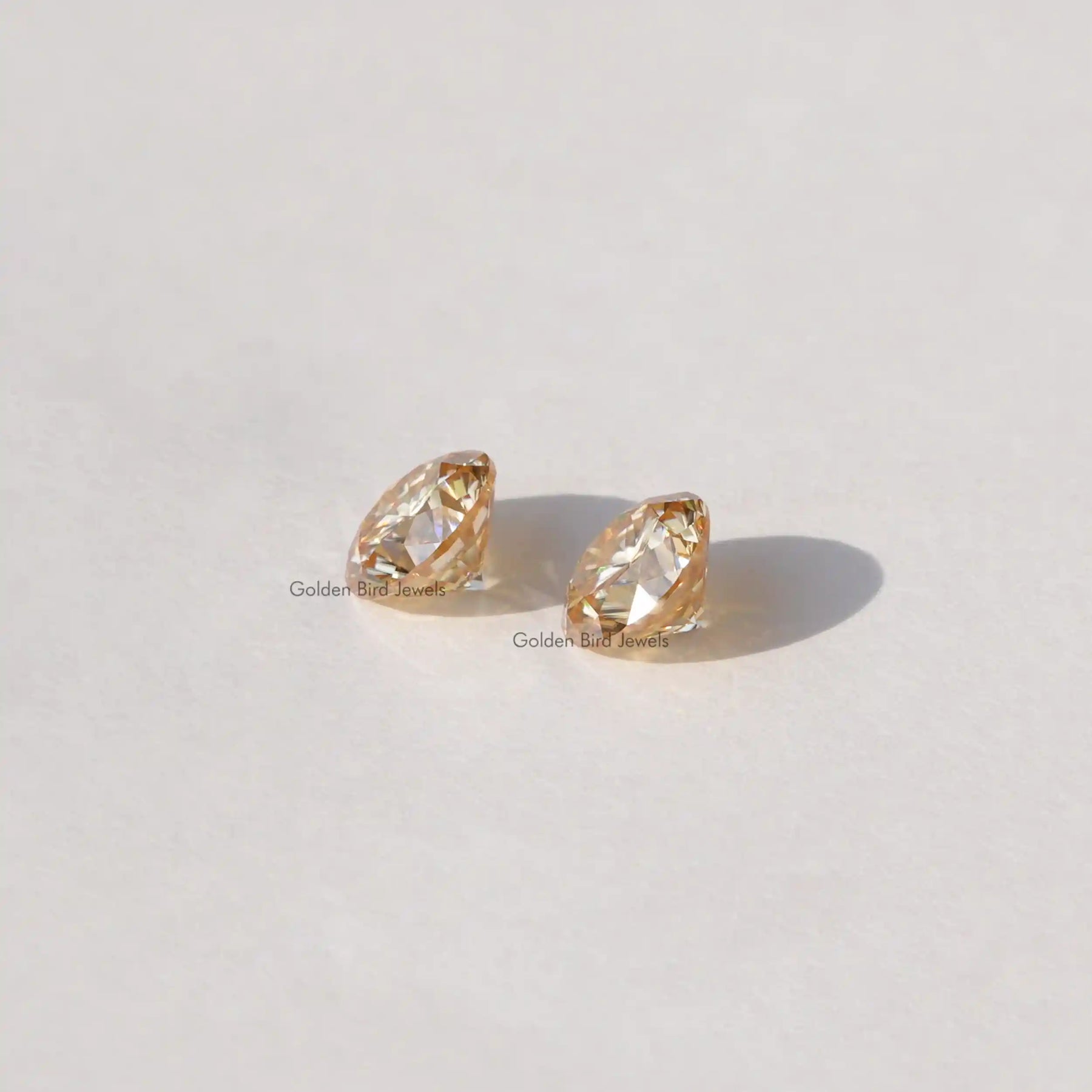 [Side view of round cut loose stones]-[Golden Bird Jewels]