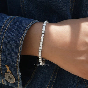 Detailed view of round shaped moissanite bracelet in prongs setting 