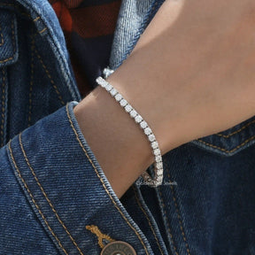 Close view of a moissanite tennis bracelet in secure setting 