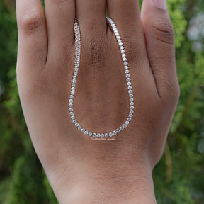 Round Cut Moissanite Tennis Necklace Displayed in Hand