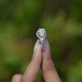 side view of halo moissanite  ring holding on two fingers 