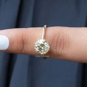In finger front View of Moissanite Solitaire Engagement Ring In Yellow Gold