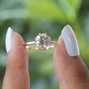 Front View of Round Cut Yellow Solitaire Moissanite Engagement Ring In two Fingers