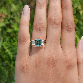 Top View Of Emerald Moissanite 3 Stone engagement ring in prongs setting 