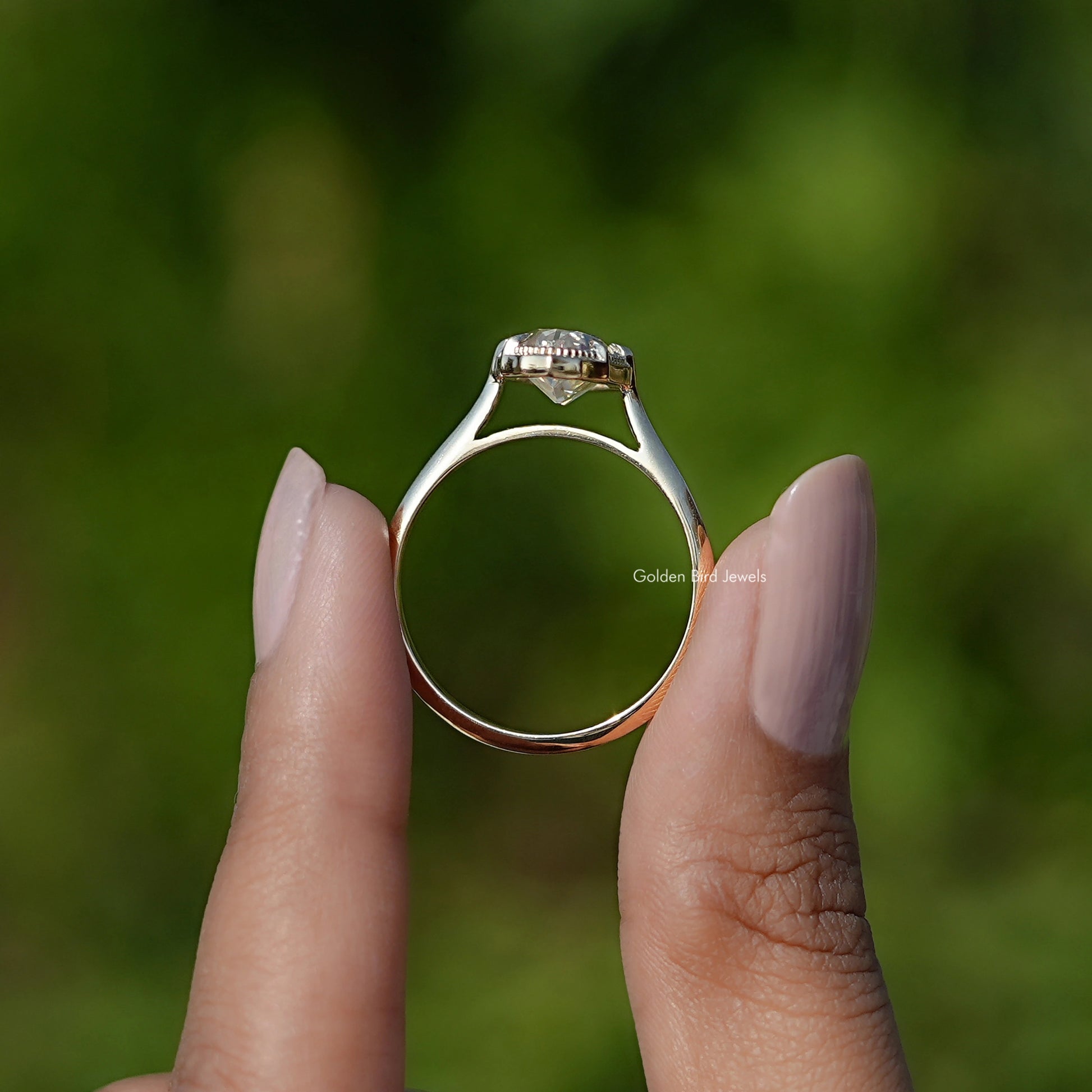 Back view of Old Mine Cut Moval Moissanite Engagement Ring in secure setting 