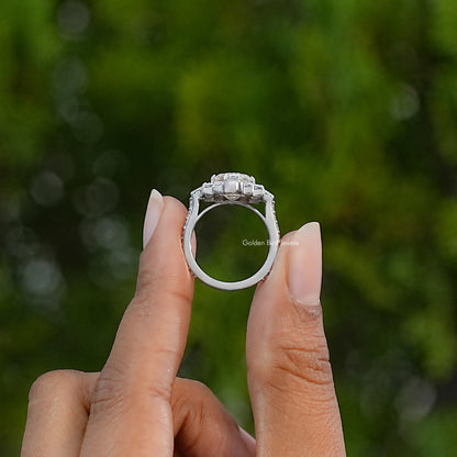 Side view of a silver moissanite ring showing its raised setting and plain band