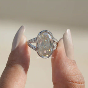 Front View of Old Mine Oval Cut Moissanite Wedding Ring In Two Fingers