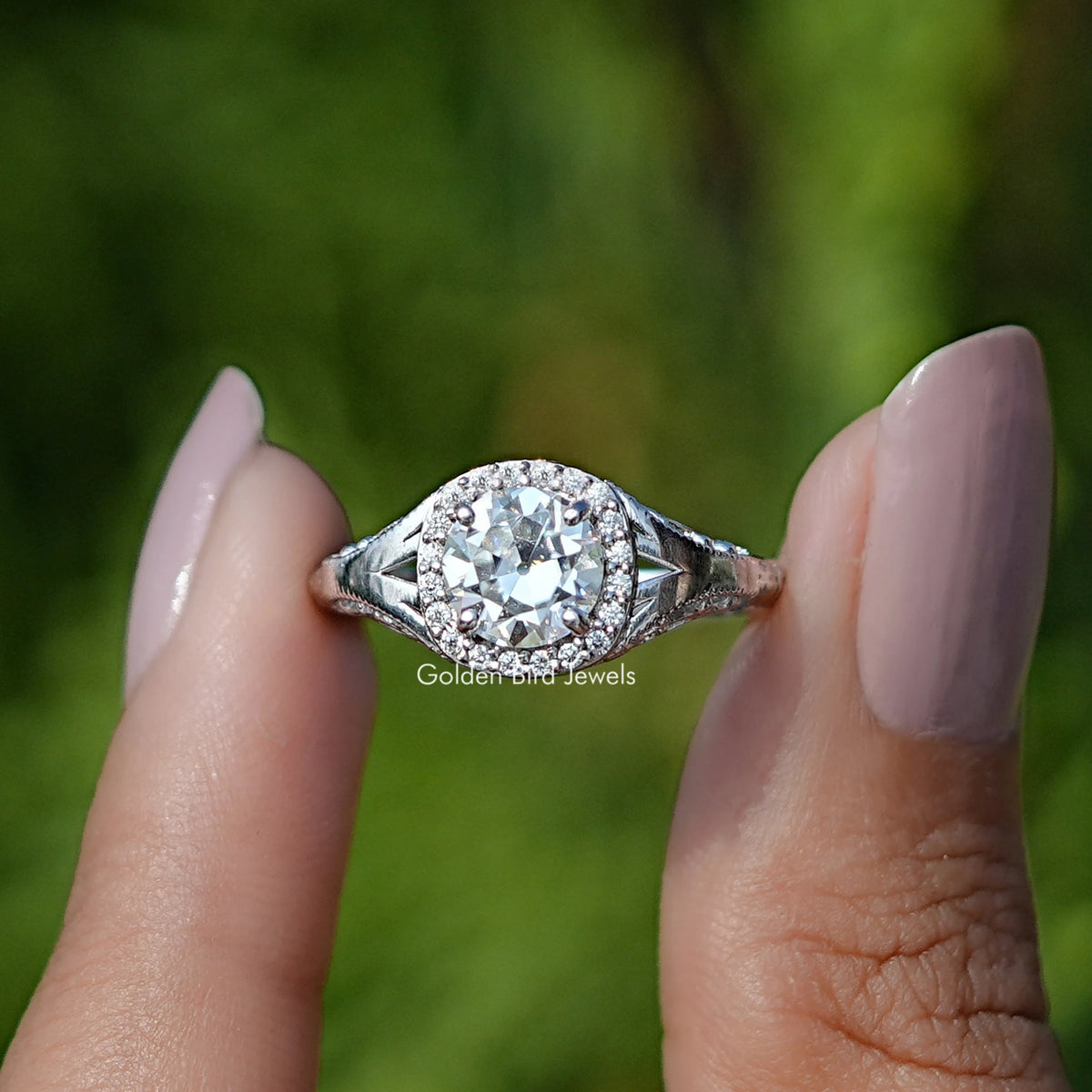 Front View of Old European Round Cut Moissanite Halo Ring In two Fingers