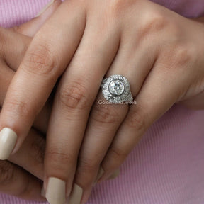 View of OEC Round Cut Moissanite Engagement Ring In Finger