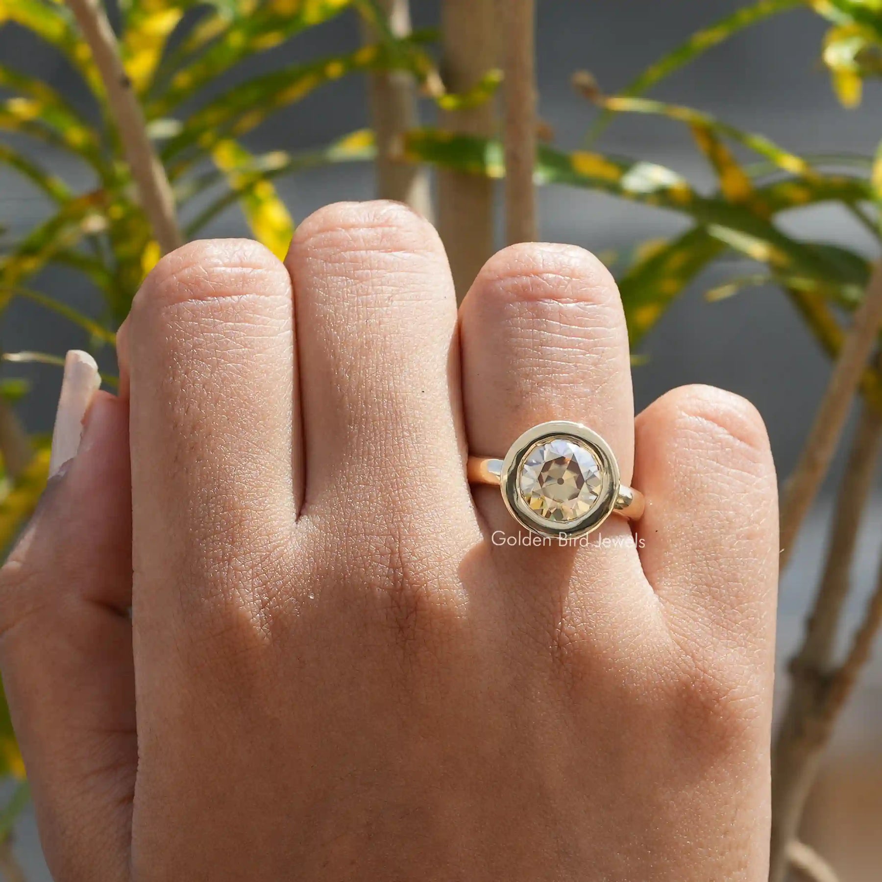 [In finger front view of old european round cut moissanite ring set in bezel]-[Golden Bird  Jewels]