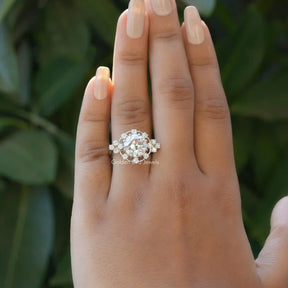 [In finger front view of old european round cut moissanite praposal ring made in 18k white gold]