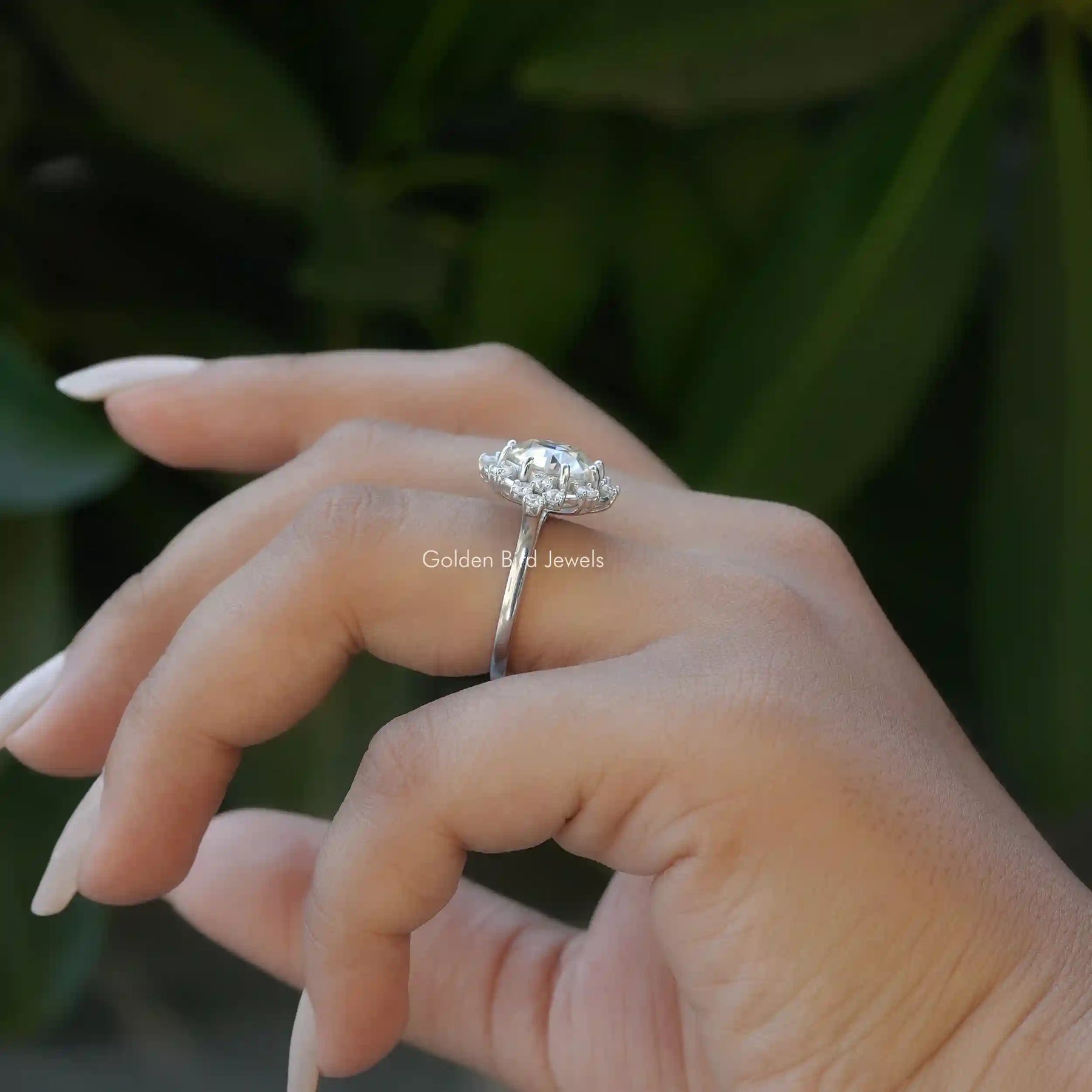 [Slightly folded finger view of old european round cut moissanite ring]