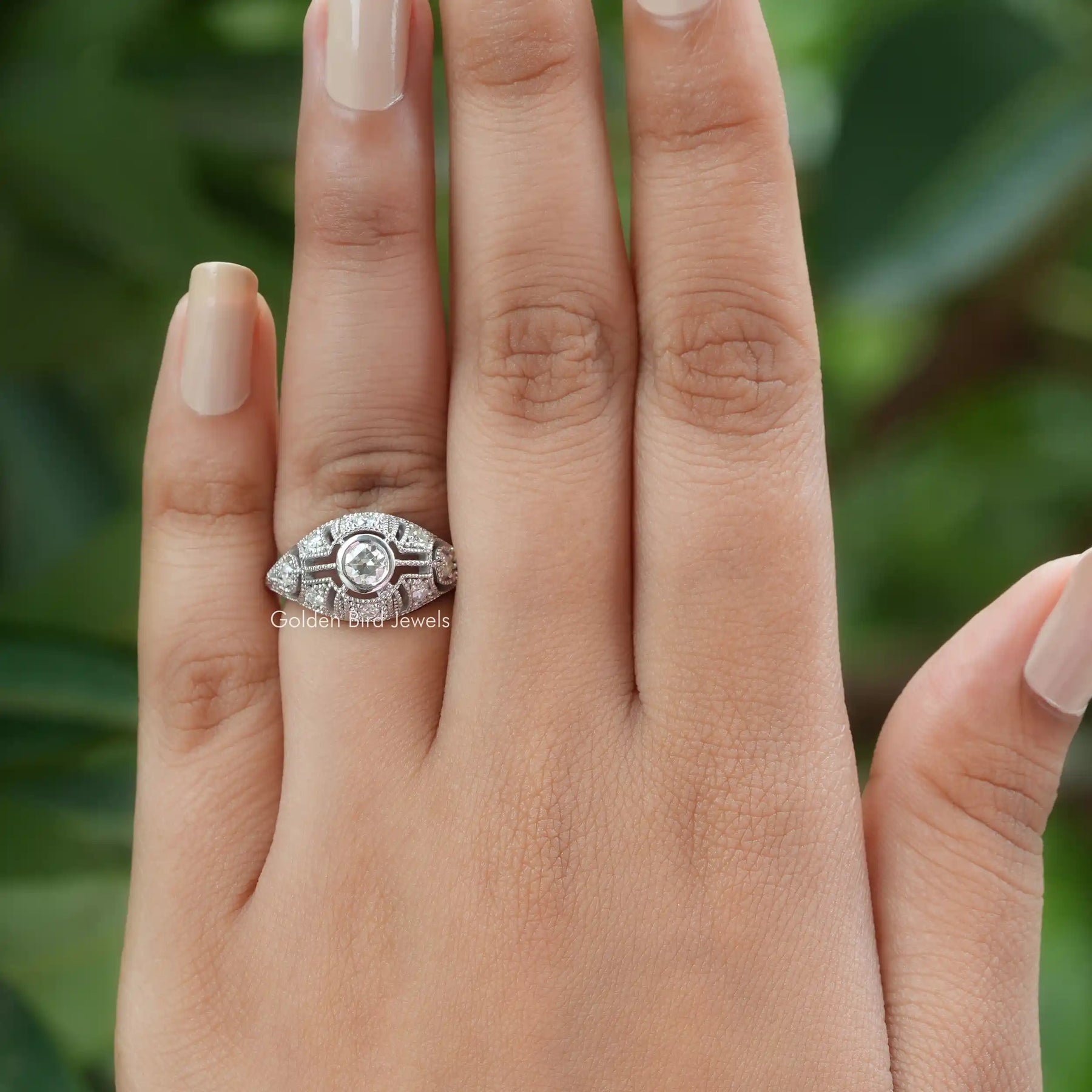 [In finger front view of moissanite vintage style round cut ring set in bezel]-[Golden Bird  Jewels]