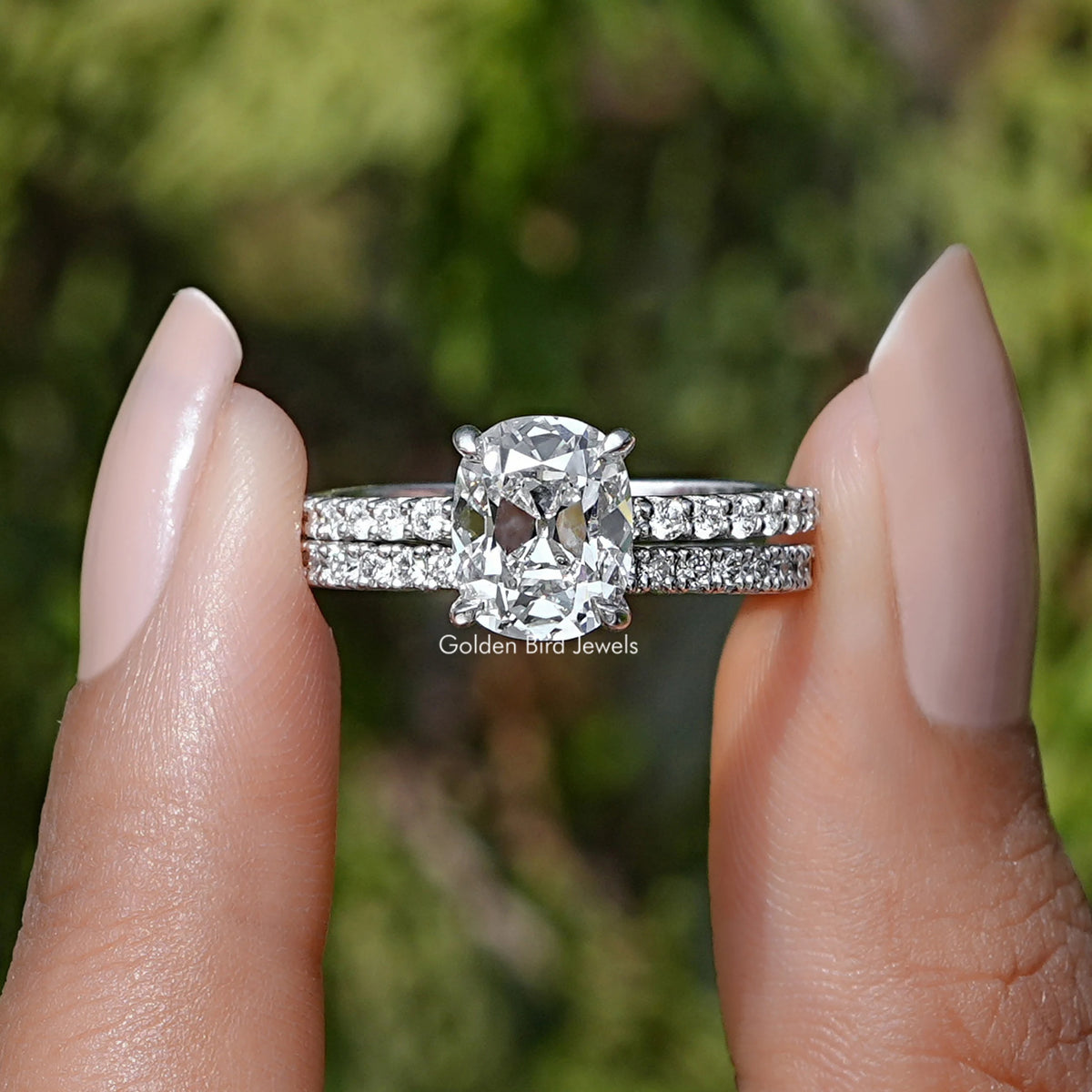 Front view of Old Mine Cushion Cut Diamond Ring Set in two fingers